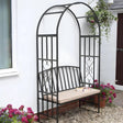 Huntingdon garden arch bench in front of house surrounded by plants and flowers