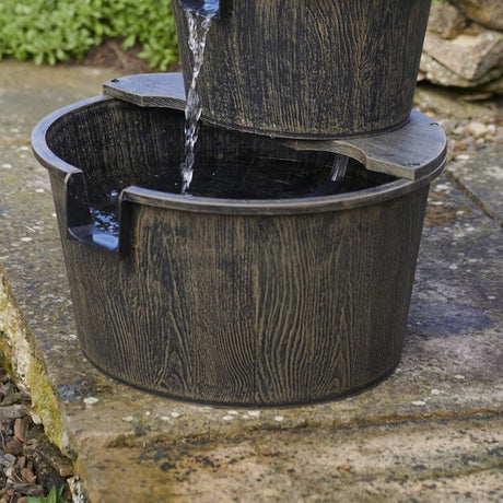 Close up of the bottom of the water feature on a stone surface