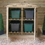 A wooden storage cabinet with two green bins