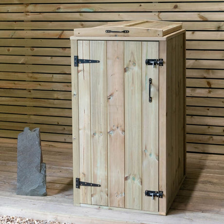 Wooden cabinet with rock on top.