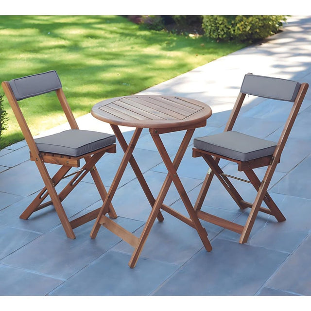 Outdoor furniture set with wooden table and two chairs.