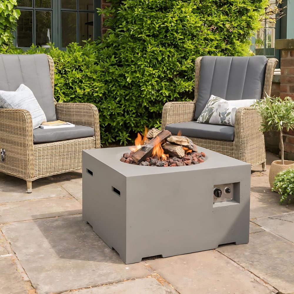 Propane fire pit in garden with garden chairs