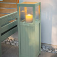 Verdi Outdoor Candle Lamp on patio setting