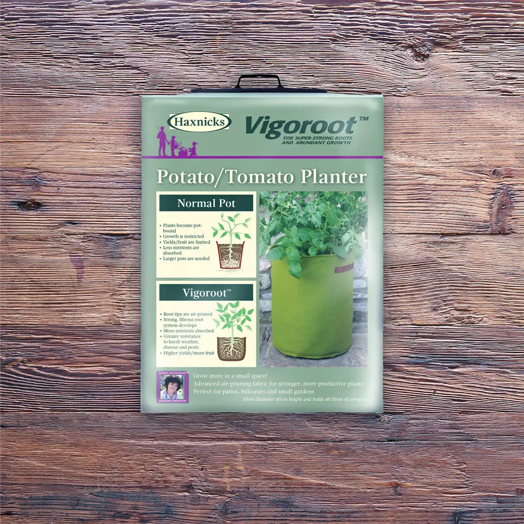 Haxnicks Vigoroot Potato/Tomato Planter packaging on a wooden surface