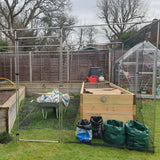 Walk in vegetable area with gardening equipment