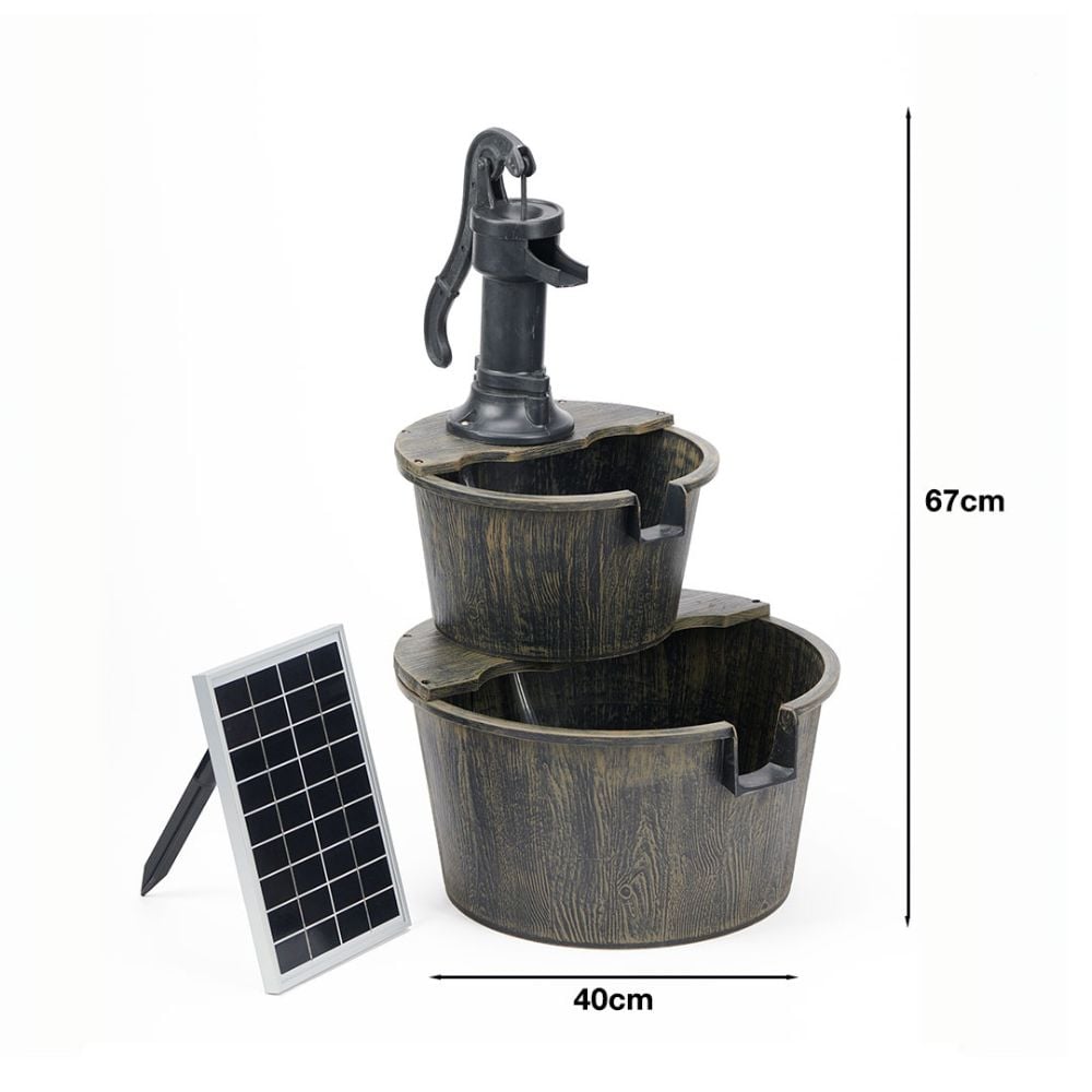 Water feature made of 2 wood effect tubs, larger on bottom, smaller on top with handled pump