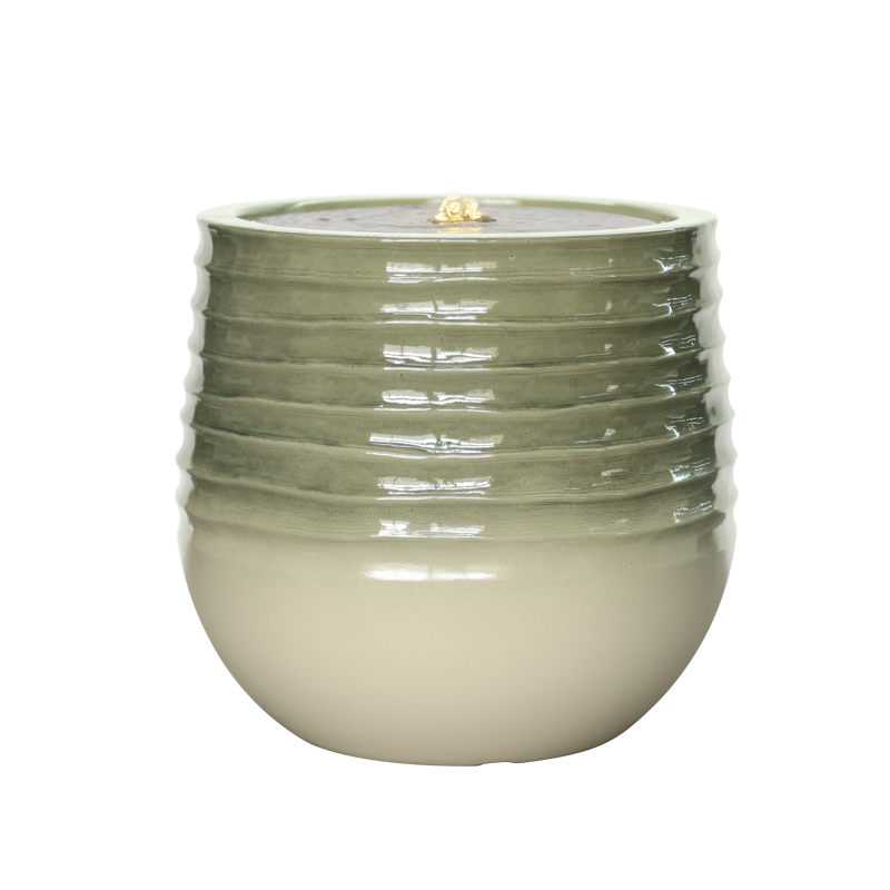 Green ceramic planter with ribbed texture with water feature
