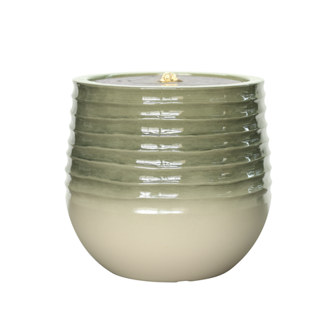 Green ceramic planter with ribbed texture with water feature