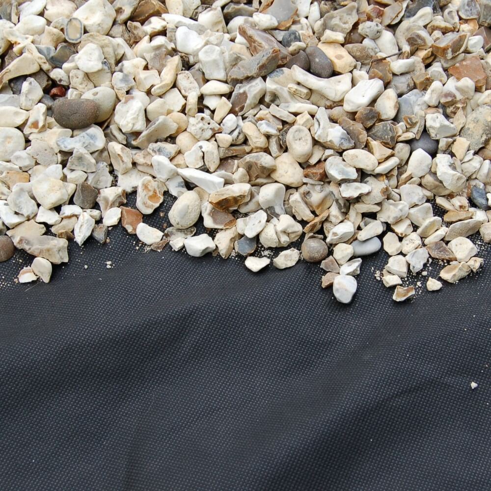 stones on landscape fabric