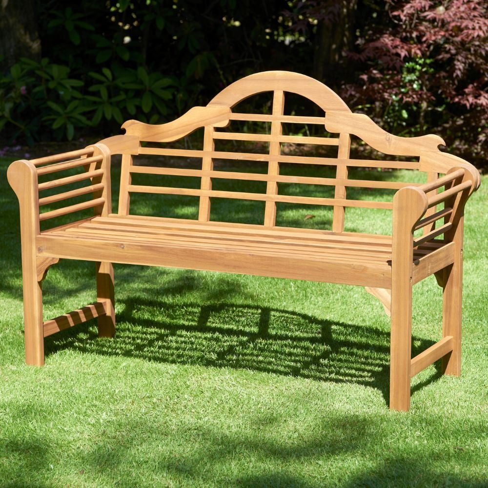Lutyens style garden bench in garden setting