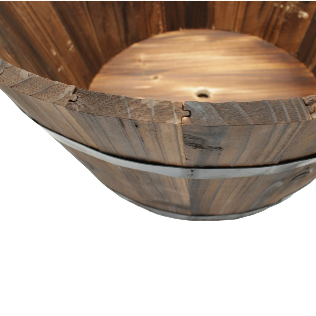 Close-up of a rustic wooden barrel-style tub or bucket with visible wood grain, metal bands, and a drain hole, isolated on a white background.