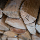 close up of wooden logs stacked
