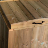 top view of a wooden panelled lid withblack metal handle for easy access