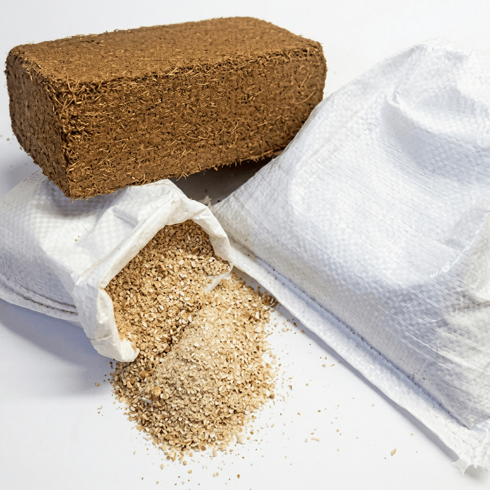 Coconut coir block with a white cloth and coconut fiber on a white background